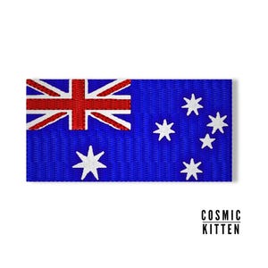 May include: A blue and red embroidered patch featuring the Australian flag. The flag has a Union Jack in the upper left corner and a constellation of seven white stars on a blue background.