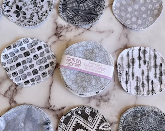 May include: A set of 10 reusable, washable, and eco-friendly facial rounds in various black and white patterns. The rounds are made of 100% cotton and are machine washable. The packaging includes the text "Farm Girl Design" and "Facial Rounds".
