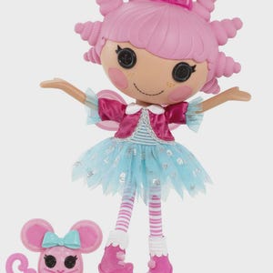 May include: A pink doll with a fairy-like design, wearing a pink dress, blue tutu, and pink shoes. The doll has a pink hairstyle and a small pink mouse accessory with a blue bow.