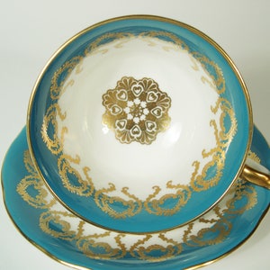 Aynsley Tea Cup and Saucer Set, Dark Turquoise and Gold Medallion Tea Cup and Saucer.