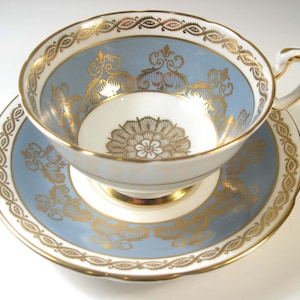 Paragon Tea cup And Saucer, Blueish Gray with gold tea cup, Gold scroll tea cup set, Gold Medallion.