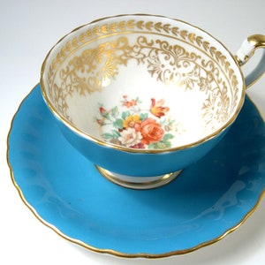 Vintage Aynsley Tea Cup And Saucer, Turquoise  tea cup  with bouquet of flowers.