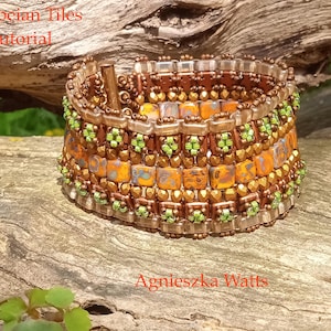 May include: A beaded bracelet with a mosaic design. The bracelet features square orange and yellow tiles, accented with green and bronze beads. The text "Pompeian Tiles Tutorial" and "Agnieszka Watts" are visible.