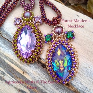 May include: Two beaded necklaces with large, iridescent, teardrop-shaped pendants. One pendant is purple, the other is blue-green. The necklaces have intricate beadwork in shades of purple, green, and gold. Text reads "Forest Maiden's Necklace" and "Agnieszka Watts @ The Sea Glass".