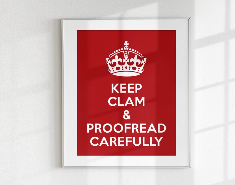 May include: A framed poster with a red background and a white crown at the top. The text on the poster reads "Keep Calm & Proofread Carefully".