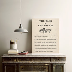 May include: A black and white illustration of two wolves, one with a more aggressive expression and the other with a more peaceful expression. The text "The Tale of Two Wolves" is at the top of the image. The text below the image reads: "An old Cherokee is teaching his grandson about life. "A fight is going on inside me," he said to the boy. "It is a terrible fight and it is between two wolves. One is evil - he is anger, envy, regret, greed, arrogance, self-pity, guilt, resentment, inferiority, lies, false pride, superiority, and  jealousy. The other is good - he is joy, peace, love, serenity, humility, kindness, benevolence, empathy, generosity, truth, compassion, and faith. The same fight is going on inside you and inside every other person, too." The grandson thought about it for a minute and then asked his grandfather, "Which wolf will win?" The old Cherokee simply replied, "The one you feed."