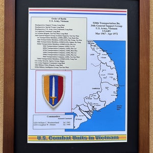 May include: Framed document detailing the U.S. Army's Order of Battle in Vietnam, including unit listings and commanders. Features a map of Vietnam and a unit patch with a sword. The frame is a dark brown color.
