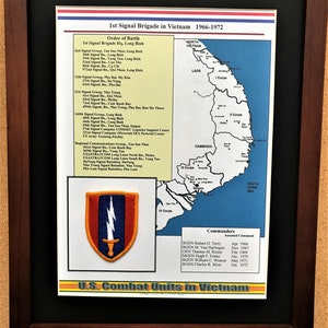 May include: Framed print titled "1st Signal Brigade in Vietnam 1966-1972." The print includes a map of Vietnam, a unit patch, and a list of units and commanders. The frame is dark brown.