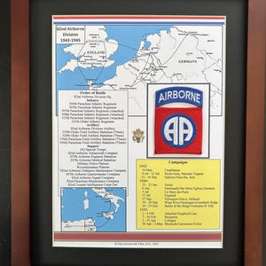May include: Framed print featuring a map and details of the 82nd Airborne Division from 1943-1945. Includes a patch with "AIRBORNE" and "82 AP" on it, along with a list of campaigns and order of battle. The print is in a brown frame.