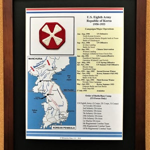 May include: Framed print of the U.S. Eighth Army in the Republic of Korea from 1950-1953. Includes a map of the Korean Peninsula, a military patch, and a list of campaigns and operations. The frame is dark brown.