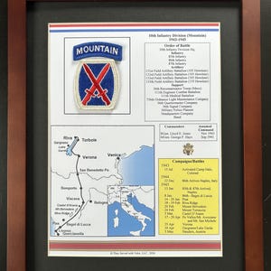 May include: Framed print featuring the 10th Infantry Division (Mountain) emblem, a blue patch with crossed red skis. The print includes a map of Italy, a list of battles, and the division's order of battle from 1943-1945.