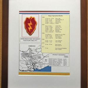 May include: Framed print featuring the 25th Infantry Division in Vietnam from 1966-1971. The print includes a division patch, a map of Cambodia, and a list of major operations and division commanders. The frame is a dark brown color.