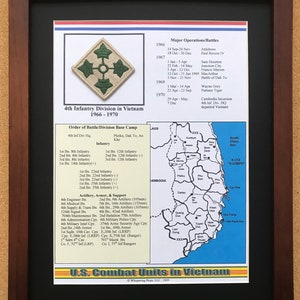 May include: Framed print featuring a military patch of the 4th Infantry Division in Vietnam, 1966-1970. The print includes a map of Vietnam, major operations, and the order of battle. The frame is dark brown.