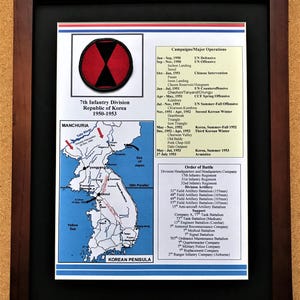 May include: Framed print of the 7th Infantry Division in the Republic of Korea, 1950-1953. The print includes a patch with a red and black design, a map of the Korean Peninsula, and a list of campaigns and major operations.