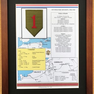 May include: Framed print of the 1st Infantry Division, 1942-1945. The print includes a patch with a red "1" on a green background, a map, and a list of campaigns, order of battle, and commanders. The frame is dark brown.