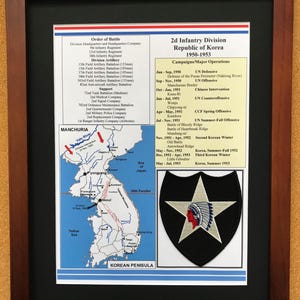 May include: Framed print of the 2d Infantry Division Republic of Korea 1950-1953. The print includes a map of the Korean Peninsula, a list of campaigns, and the division's insignia, featuring a star and Native American profile.