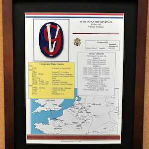May include: Framed print of the 95th Infantry Division, 1944-1945, with a Victory Division patch. Includes a list of campaigns, major battles, and commanders. A map of Europe shows the division's movements. The frame is dark brown.