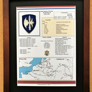 May include: Framed print detailing the 65th Infantry Division during World War II, 1944-1945. The print features a division patch, campaign dates, order of battle, and a map of Europe. The frame is dark brown.
