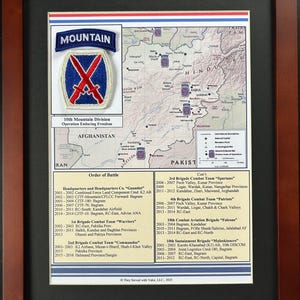 May include: A framed display featuring a 10th Mountain Division patch above a map of Afghanistan marked with military locations. Below the map, a detailed text section titled Order of Battle lists various brigade deployments and dates.