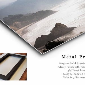 May include: A metal print of a seascape with a rocky coastline and a misty sky. The print has a glossy finish and is framed with a 3/4 inch inset frame.