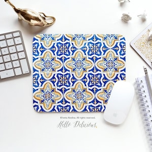 May include: A blue and yellow patterned mouse pad with a white background. The pattern is reminiscent of traditional Portuguese tiles. The text "Hello Delicious." is printed in black at the bottom of the mouse pad.