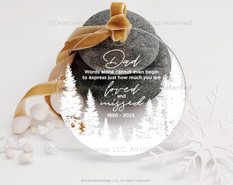 May include: A clear glass ornament with a white winter scene and the text "Dad Words alone cannot even begin to express just how much you are loved and missed 1950-2023".