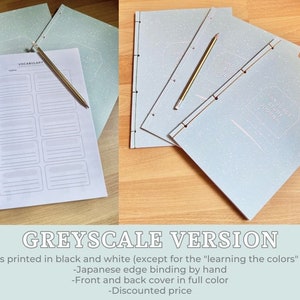 May include: A grayscale version of a language study journal with a Japanese binding. The cover is light blue with a white speckled pattern and the text "Language Study Journal" printed in white. The inside pages are blank and ready for writing.