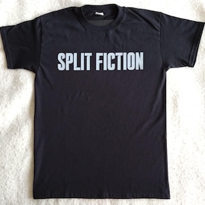 May include: Black t-shirt with the text "SPLIT FICTION" printed in white on the front.