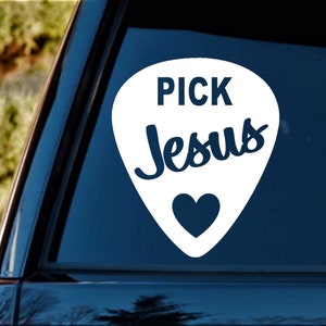 May include: White guitar pick shaped decal with the text "PICK Jesus" in blue lettering and a blue heart at the bottom.