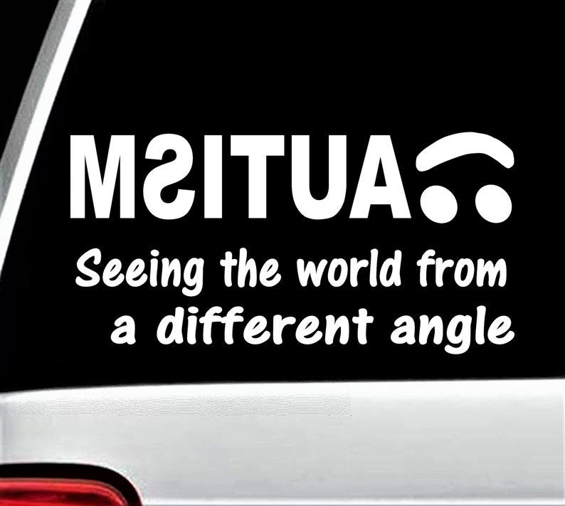 May include: A black and white sticker with the text "M2ITUA" and the words "Seeing the world from a different angle".