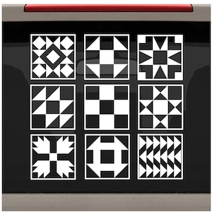 May include: Nine black and white quilt block patterns. Each pattern is a square with a different geometric design. The patterns are arranged in a 3x3 grid.