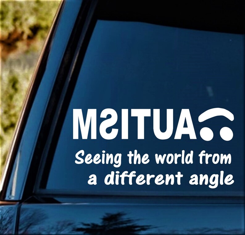 May include: White vinyl sticker with the text "M2ITUA" and the words "Seeing the world from a different angle".