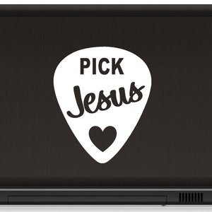 May include: A black laptop with a white guitar pick sticker that says "Pick Jesus" with a heart in the center.