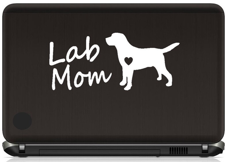 May include: White vinyl sticker with a silhouette of a Labrador Retriever and the text "Lab Mom" on a black laptop.