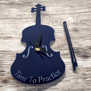 Violin Shaped Clocks - Custom colours and Woods. Engraving and Bespoke Shapes & Sizes Made