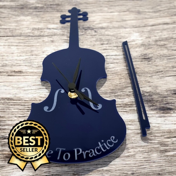 Relojes con forma de violín: colores y maderas personalizados. Grabados y formas y tamaños a medida.
