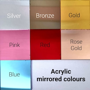 May include: A collection of acrylic mirrored color samples. Colors include silver, bronze, gold, pink, red, rose gold, blue, and white. The text "Acrylic mirrored colours" is displayed at the bottom of the image.