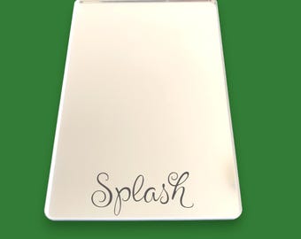May include: White rectangular tray with a silver rim and the word "Splash" written in cursive on the bottom.