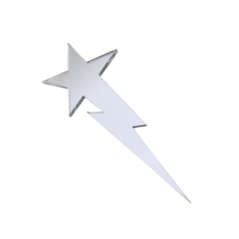 May include: A silver star-shaped lightning bolt ornament. The star is at the top of the bolt and the bolt is pointed at the bottom.