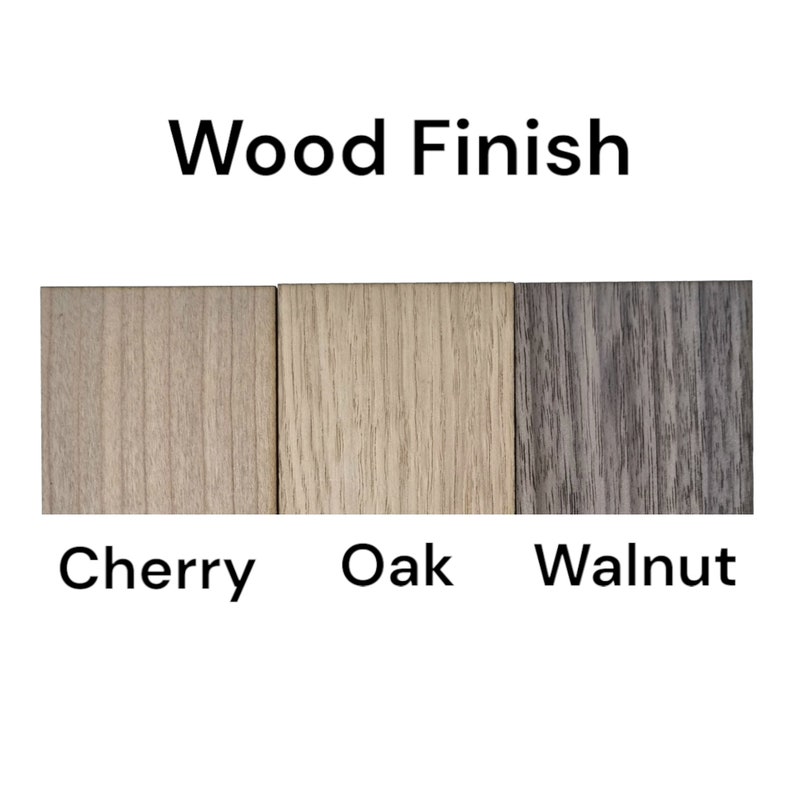 May include: Image showing three wood finish samples: Cherry, Oak, and Walnut. The text "Wood Finish" is above the samples. The Cherry sample is light brown, the Oak sample is beige, and the Walnut sample is gray.