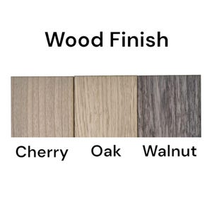 May include: Three wood samples showing different wood finishes: cherry, oak, and walnut.
