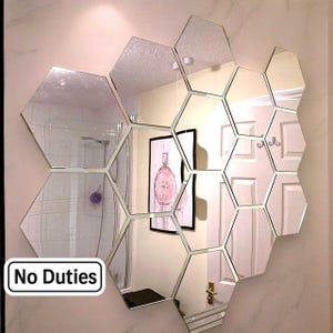 Espejos plateados hexagonales en paquetes de diez, maderas, tamaños y colores personalizados.