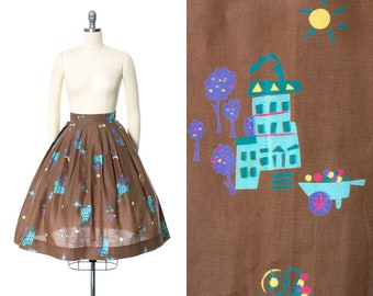 Vintage 1950s Skirt | 50s Novelty Print Cotton Floral Cart People Pleated Brown Full Swing Skirt (x-small)