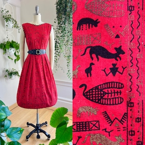 Vintage 1950s Sundress | 50s Egyptian Hieroglyphics Novelty Print Cats Animals Red Cotton Ric Rac Metallic Fit Flare Day Dress  (x-small)