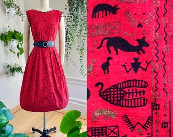 Vintage 1950s Sundress | 50s Egyptian Hieroglyphics Novelty Print Cats Animals Red Cotton Ric Rac Metallic Fit Flare Day Dress  (x-small)