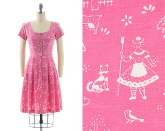 Vintage 1960s Dirndl Dress | 60s Cat Animals People Floral Novelty Print Pink Cotton Full Skirt German Shirtwaist Day Dress (x-small)