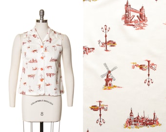 Blusa vintage de los años 70 / Blusa abotonada sin mangas de poliéster blanco roto con estampado de ciudad europea de los años 70 (pequeña)