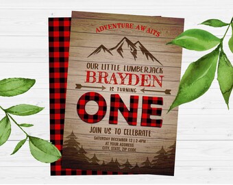 May include: A printable invitation for a first birthday party with a lumberjack theme. The invitation features a red and black plaid pattern, a wooden background, and the text "Adventure Awaits", "Our Little Lumberjack Brayden is Turning One", and "Join Us To Celebrate".