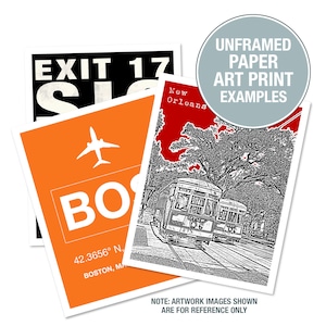 May include: Three examples of unframed paper art prints. The first print is a black and white illustration of a streetcar in New Orleans. The second print is a black and white illustration of a plane with the text "BOS" and "42.3656° N. BOSTON, MA". The third print is a black and white illustration of a sign that says "EXIT 17".