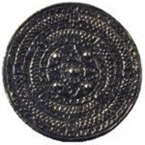 May include: A black metal circular medallion with a detailed design featuring a central star and concentric circles.